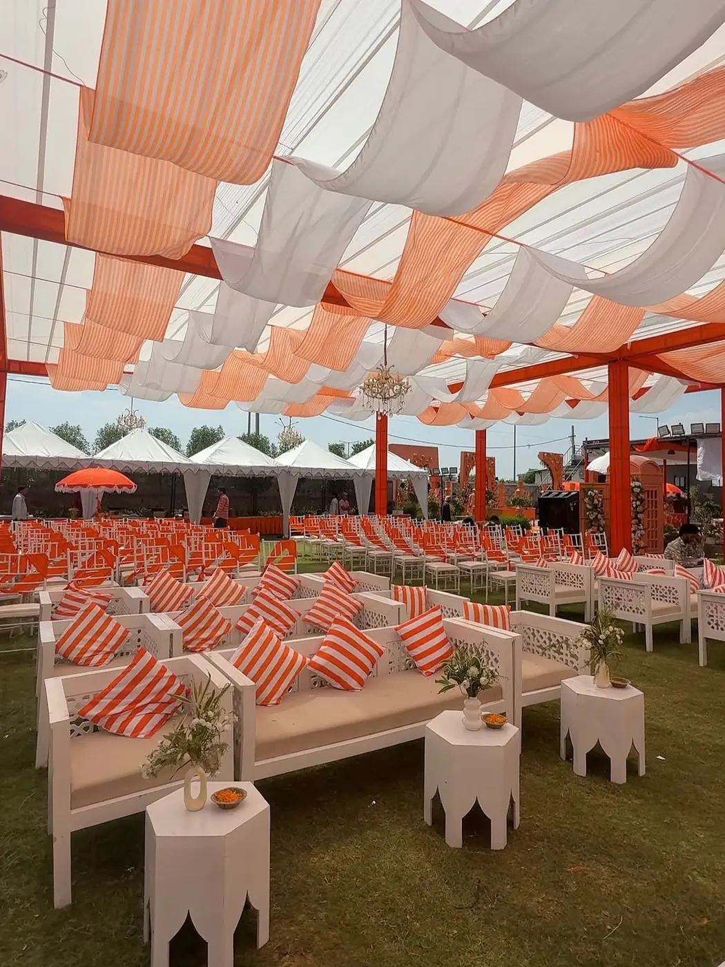 Orange and white tent for corporate wedding Udaipur