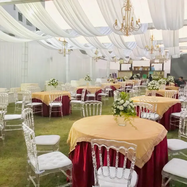 Burgundy gold reception table decor Udaipur