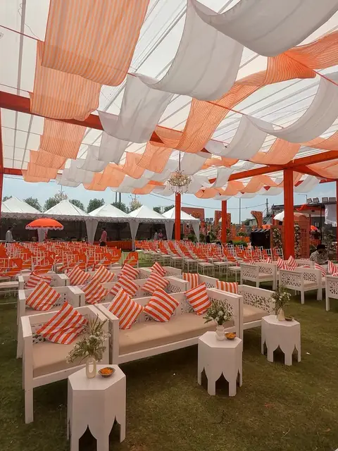 Orange and white tent for corporate wedding Udaipur